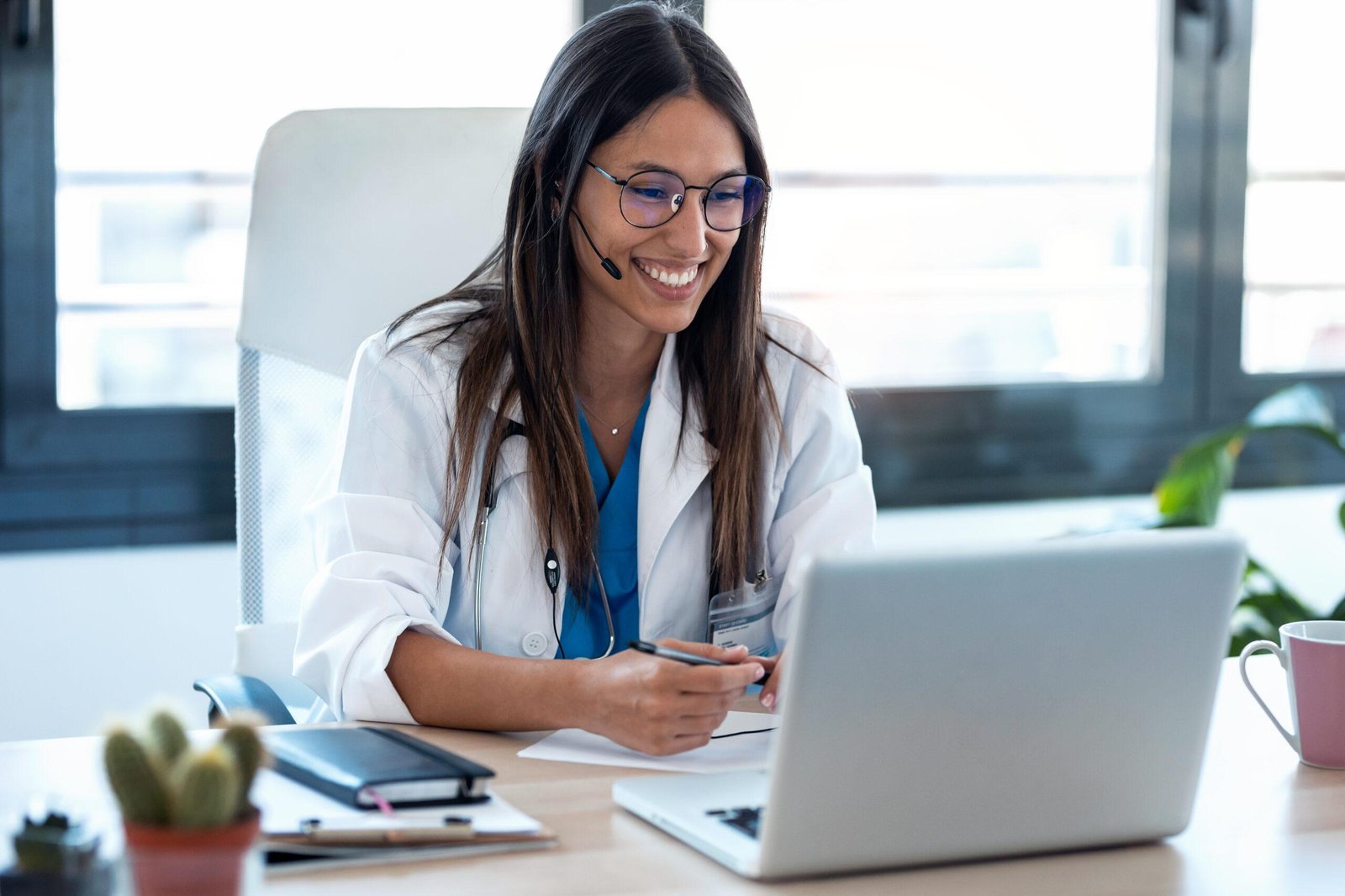 Psychiatrist performing a telehealth visit after a patient searched "what if I can't find a psychiatrist near me?" Psychiatrist talking to patient via telepsychiatry Kareo platform.